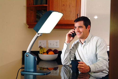 Man using Carex Health Brands Day Light-Sky on the phone